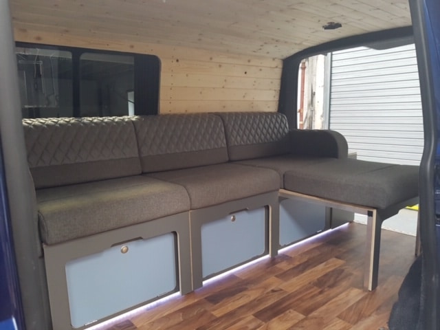 cjl-leisure-scandi-vibe-mtb-van-neutral-wood-interior and side mount sofa with concealed high pressure wash down kit